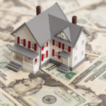 House on top of a pile of money House on top of a pile of money