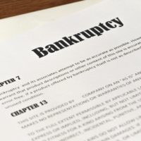 Chapter 7 Bankruptcy form with pen on top Chapter 7 Bankruptcy form with pen on top