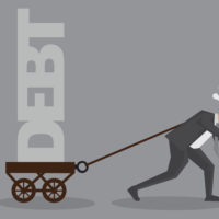 Man pulling a wagon of debt.jpg.crdownload Man pulling a wagon of debt.jpg.crdownload