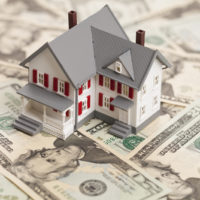 House on top of a pile of money House on top of a pile of money