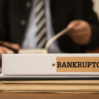 Attorney reviewiing a bankruptcy file.jpg.crdownload Attorney reviewiing a bankruptcy file.jpg.crdownload