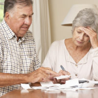 Senior Couple Concerned About Debt Going Through Bills Together