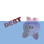 Piggy bank submerged under water to indicate discharge of debt Piggy bank submerged under water to indicate discharge of debt