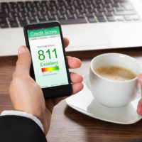 Businessman Checking Credit Score On Cellphone app Businessman Checking Credit Score On Cellphone app