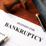 Petition for Bankruptcy on an office table. Petition for Bankruptcy on an office table.