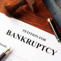 Petition for Bankruptcy on an office table. Petition for Bankruptcy on an office table.