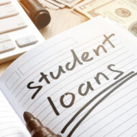 Student loan handwritten in a note. Money for education. Student loan handwritten in a note. Money for education.