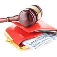 Gavel and money in wallet isolated on white Gavel and money in wallet isolated on white