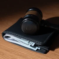 Gavel on top of a wallet. Wage garnishment, fines, or financial judgments concept.